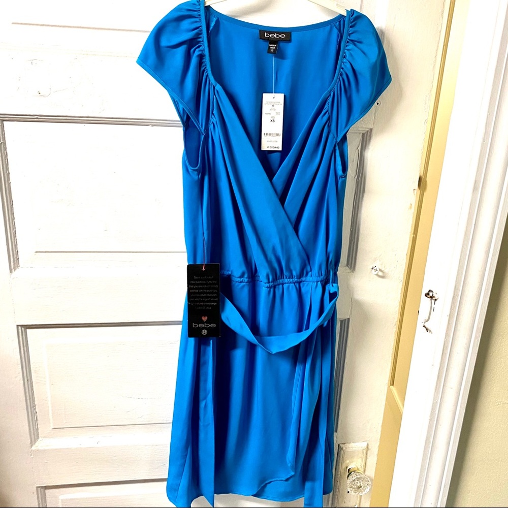 Bebe bright blue surplice s/s dress. Xs. NWT.